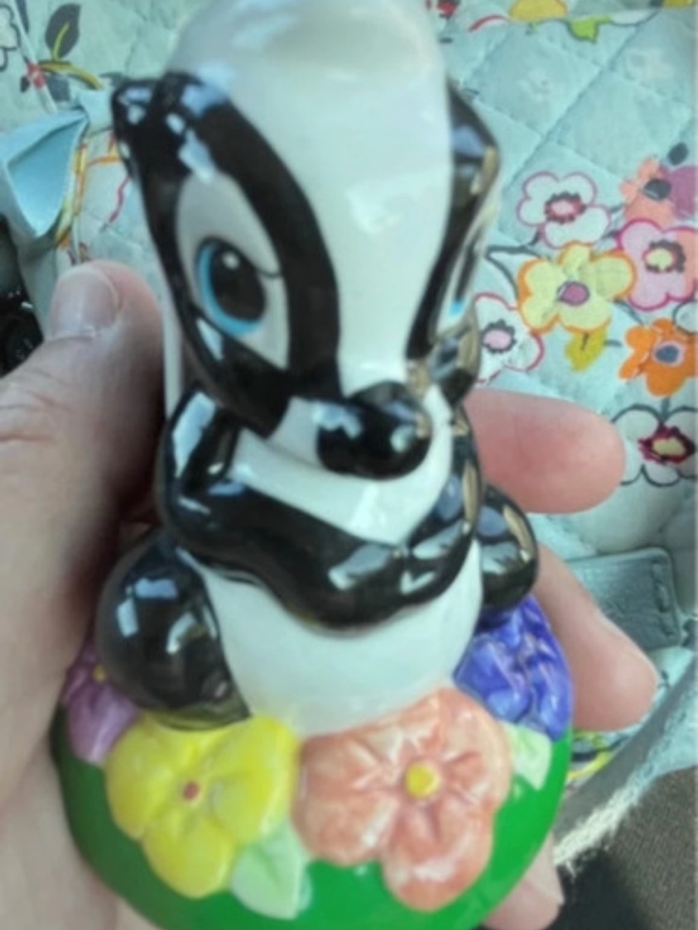 Disney Black and White Skunk Figurine with Colorful Floral Base